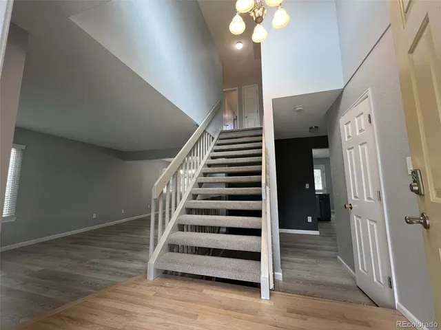 a view of entryway with wooden floor