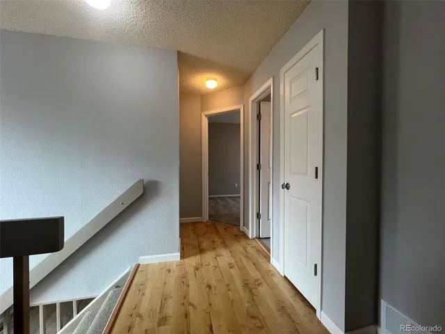 a view of hallway with stairs