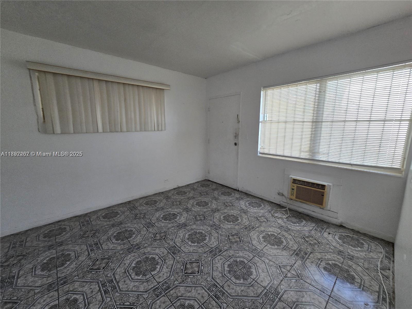 70 Northwest 77th Street, Unit 11 Miami, FL 33150 - Photo 14 of 17 a room with a window