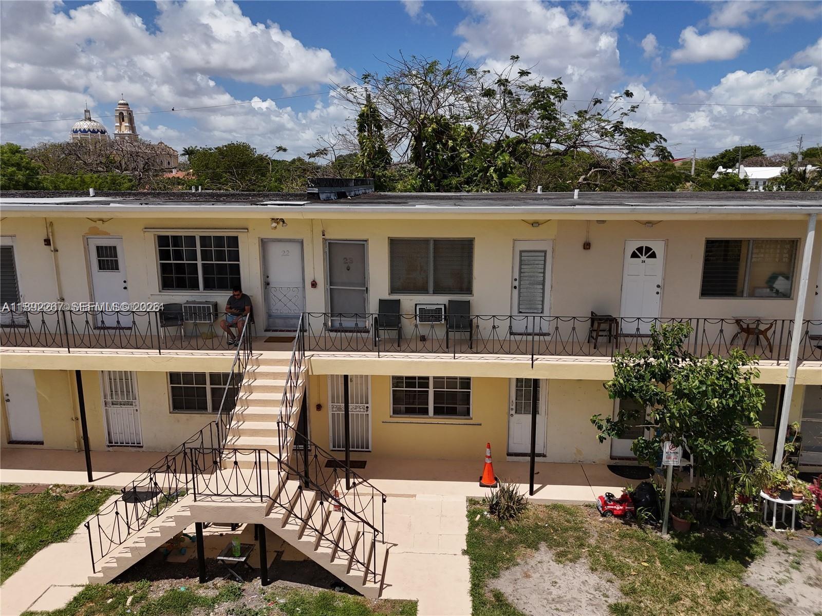 70 Northwest 77th Street, Unit 11 Miami, FL 33150 - Photo 15 of 16 a view of house with roof deck and seating space