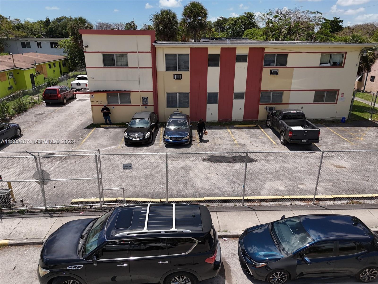 70 Northwest 77th Street, Unit 11 Miami, FL 33150 - Photo 16 of 16 a car parked beside a road next to a road