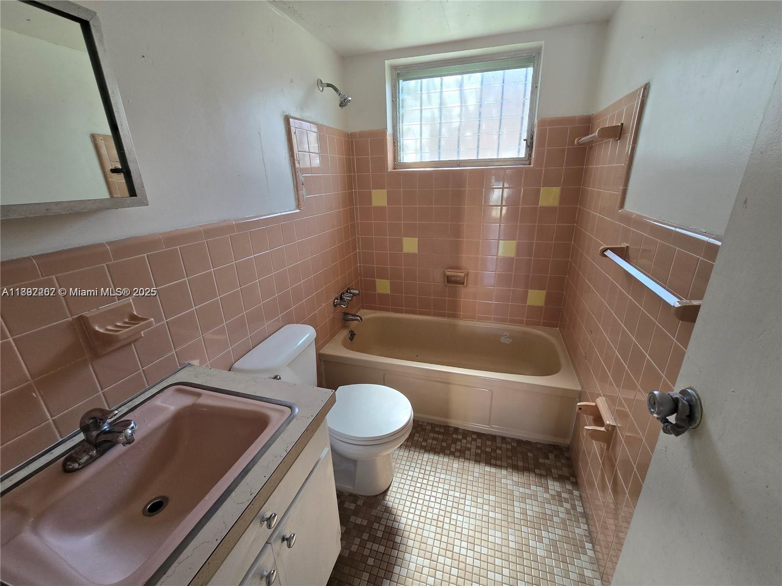 70 Northwest 77th Street, Unit 11 Miami, FL 33150 - Photo 4 of 17 a bathroom with a sink toilet and shower