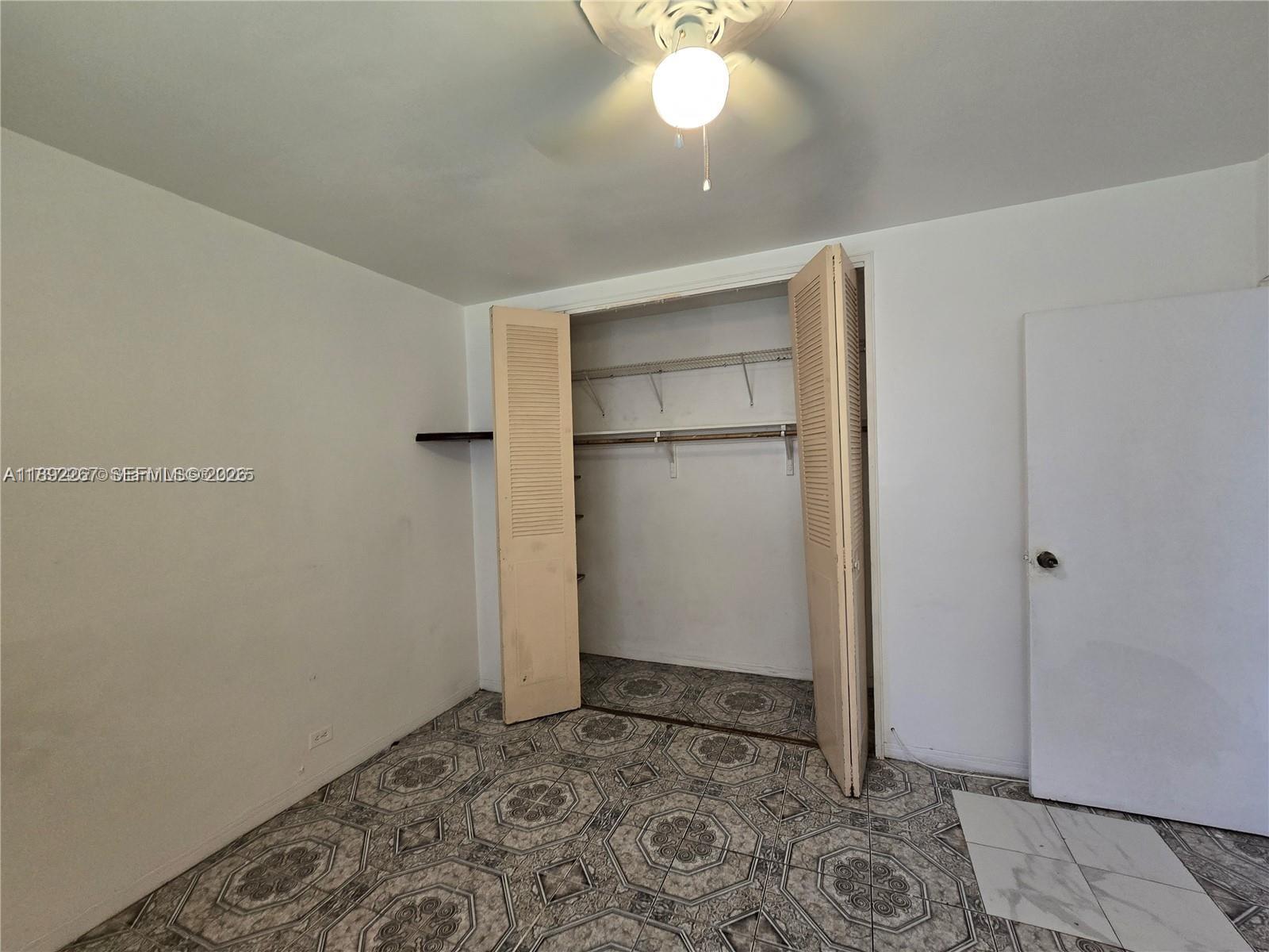 70 Northwest 77th Street, Unit 11 Miami, FL 33150 - Photo 5 of 16 a view of an empty room