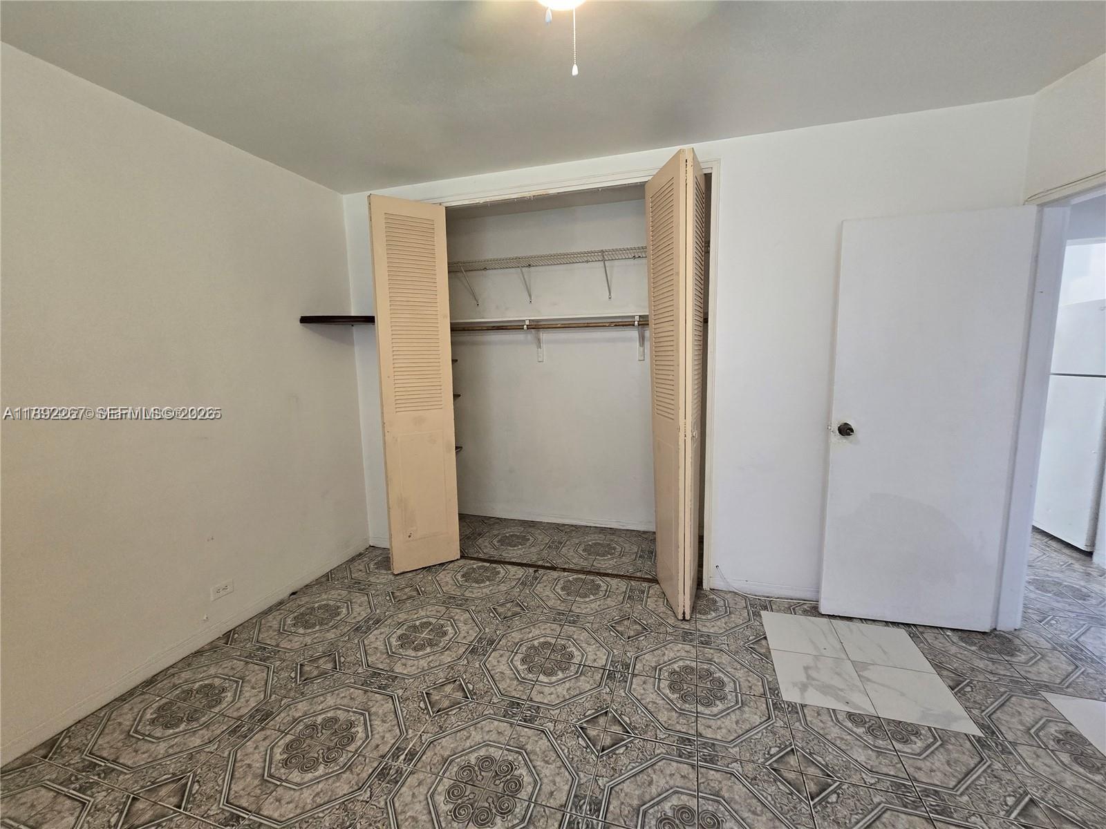 70 Northwest 77th Street, Unit 11 Miami, FL 33150 - Photo 6 of 16 a view of an empty room