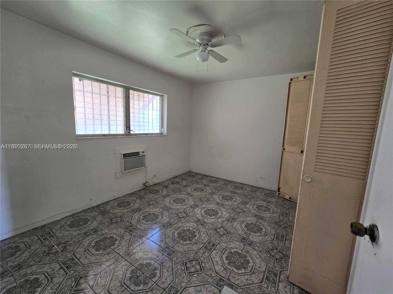 70 Northwest 77th Street, Unit 11 Miami, FL 33150 - Photo 8 of 16 a view of a window in an empty room