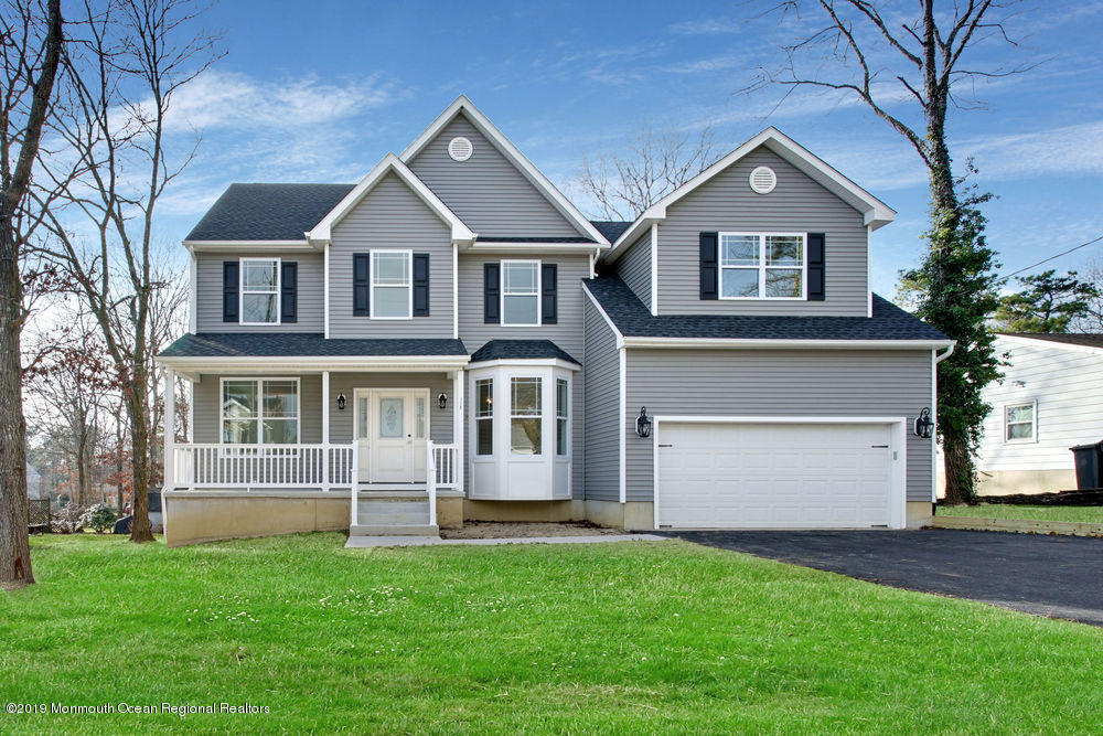 113 Lanyard Road Manahawkin, NJ 08050 - Photo 1 of 71 a front view of a house with a yard