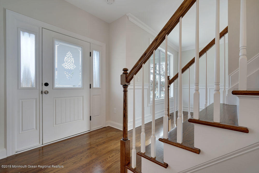 113 Lanyard Road Manahawkin, NJ 08050 - Photo 11 of 71 a view of entryway with wooden floor and stairs