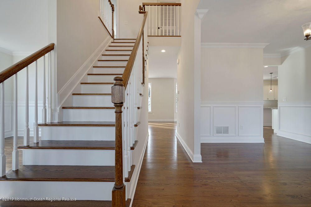 113 Lanyard Road Manahawkin, NJ 08050 - Photo 13 of 71 a view of entryway with wooden floor and stairs
