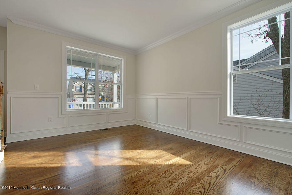 113 Lanyard Road Manahawkin, NJ 08050 - Photo 17 of 71 a view of an empty room with wooden floor and a window