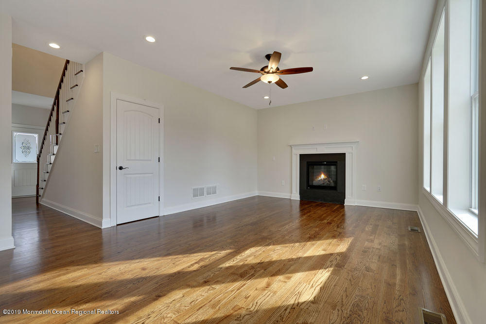 113 Lanyard Road Manahawkin, NJ 08050 - Photo 20 of 71 a view of empty room with wooden floor and fan