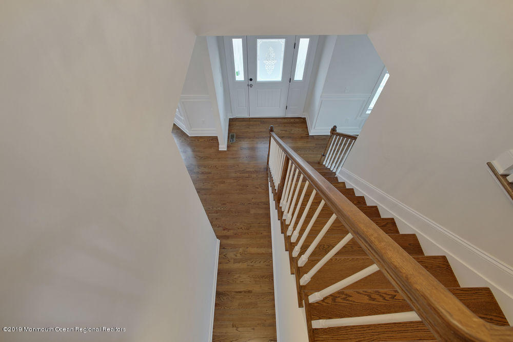 113 Lanyard Road Manahawkin, NJ 08050 - Photo 35 of 71 a view of entryway and hall with wooden floor