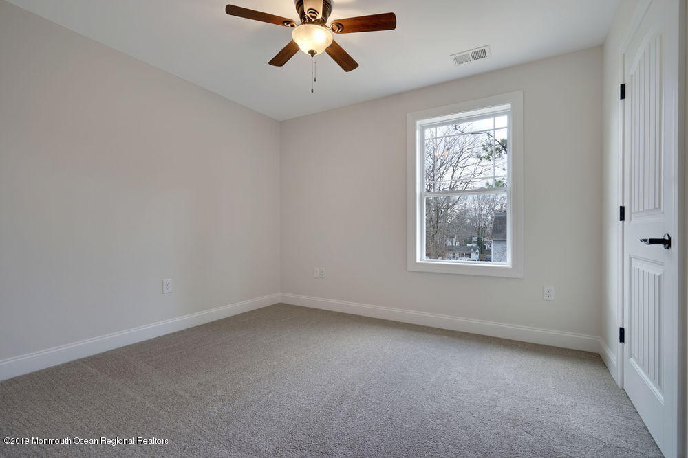 113 Lanyard Road Manahawkin, NJ 08050 - Photo 38 of 71 an empty room with a window