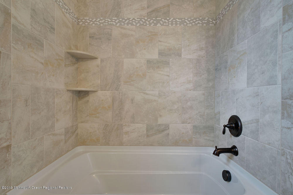 113 Lanyard Road Manahawkin, NJ 08050 - Photo 41 of 71 a bathroom with a bathtub