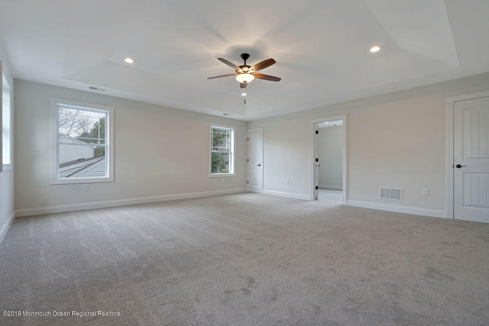 113 Lanyard Road Manahawkin, NJ 08050 - Photo 46 of 71 a view of a livingroom with a ceiling fan and window