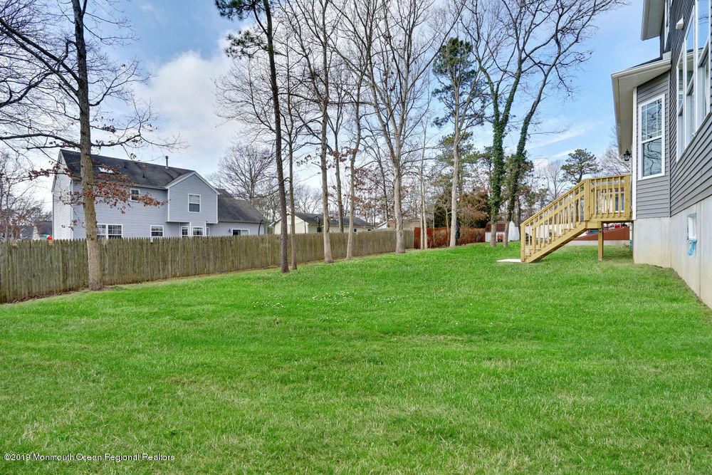 113 Lanyard Road Manahawkin, NJ 08050 - Photo 62 of 71 a view of a house with backyard and a tree