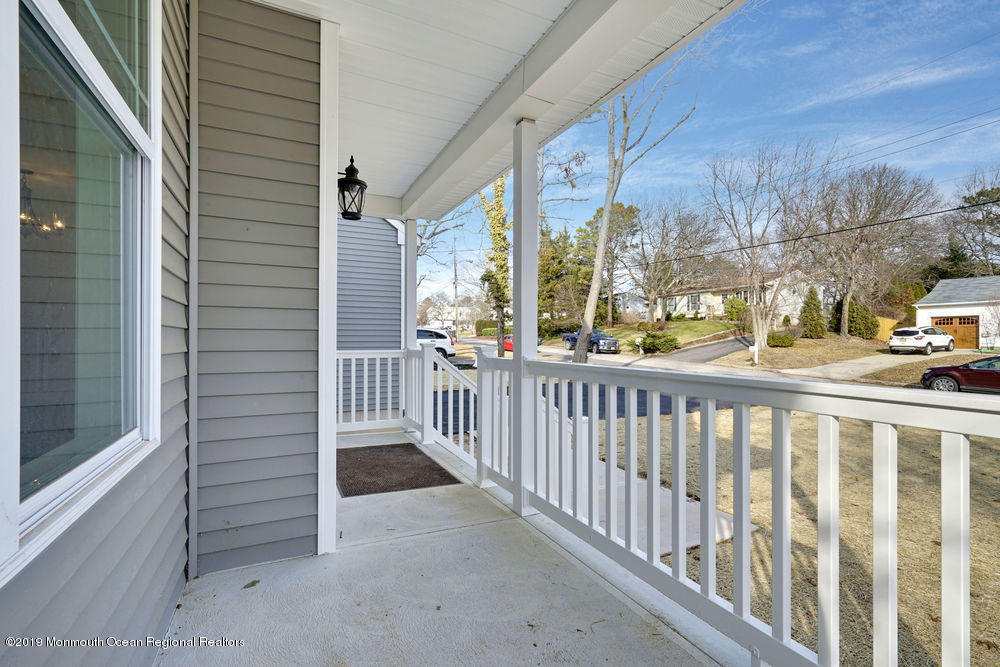 113 Lanyard Road Manahawkin, NJ 08050 - Photo 65 of 71 a view of a porch with a floor to ceiling window
