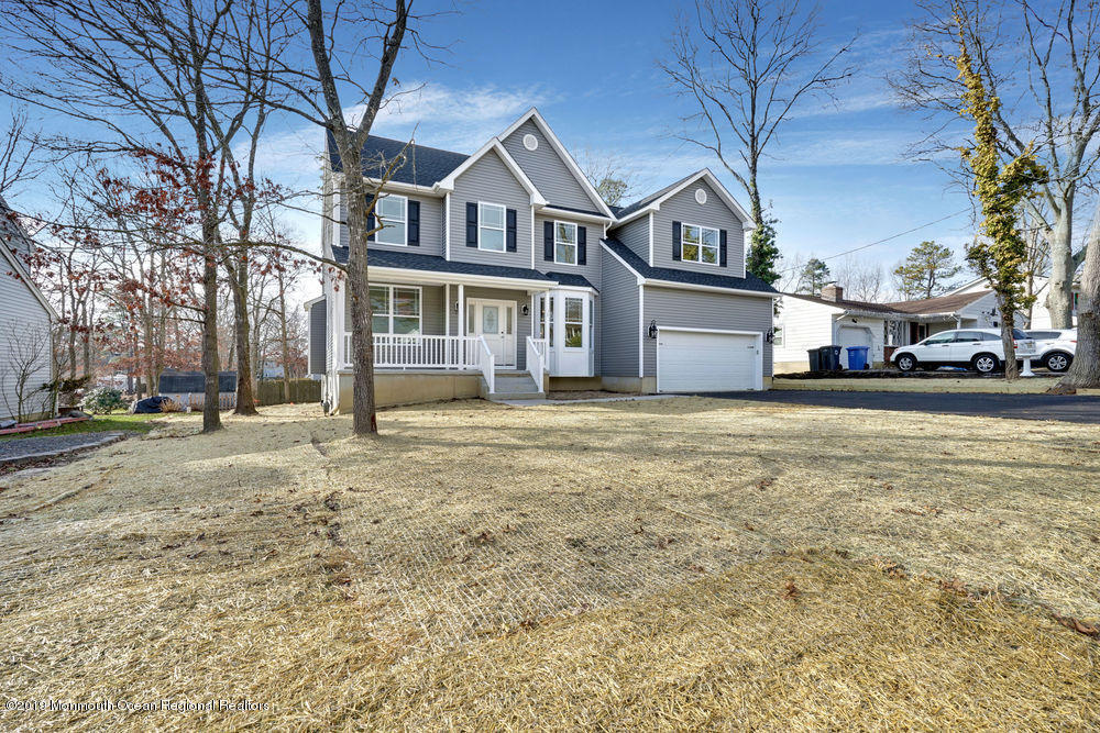 113 Lanyard Road Manahawkin, NJ 08050 - Photo 66 of 71 a front view of a house with a yard