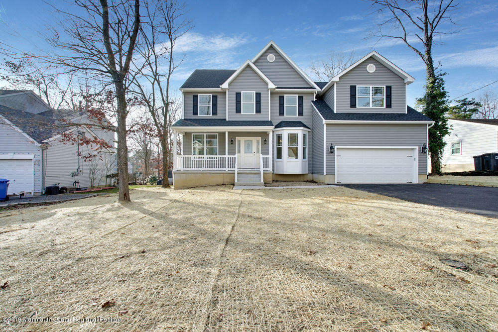 113 Lanyard Road Manahawkin, NJ 08050 - Photo 67 of 71 a front view of a house with a yard