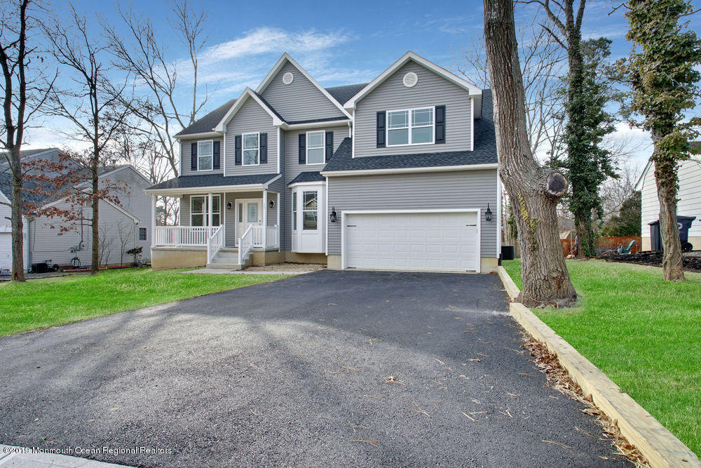 113 Lanyard Road Manahawkin, NJ 08050 - Photo 8 of 71 a front view of house with yard and green space