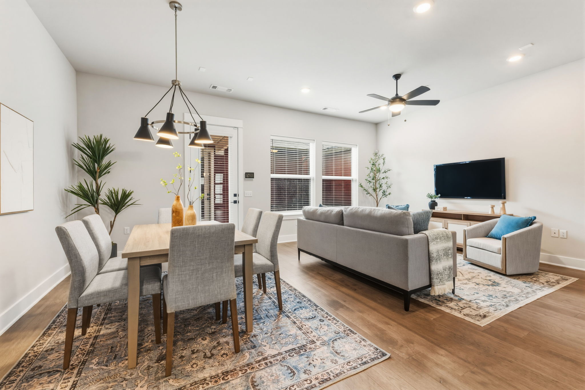 2929 Moreno Street Austin, TX 78723 - Photo 14 of 40 Open-concept living area featuring wood-finish flooring, recessed lighting, and a contemporary ceiling fan