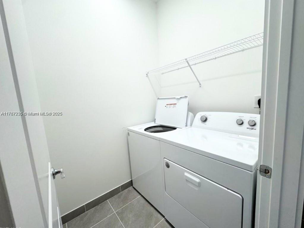 5277 Marano Drive Ave Maria, FL 34142 - Photo 12 of 23 a utility room with dryer and washer