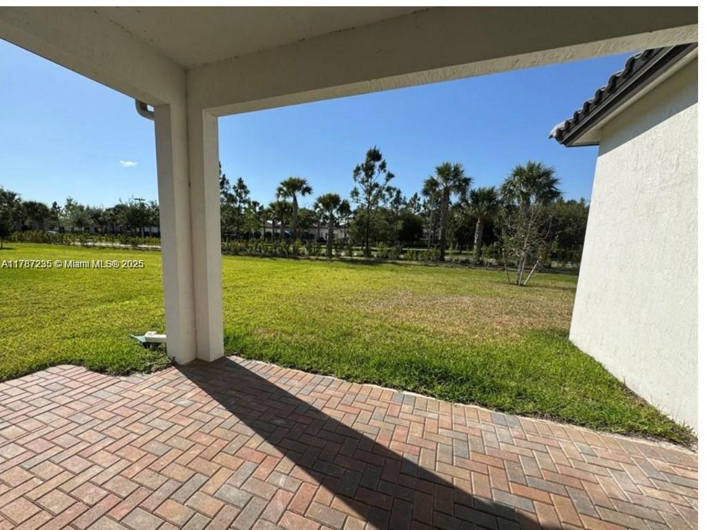 5277 Marano Drive Ave Maria, FL 34142 - Photo 14 of 23 a view of a backyard of a house