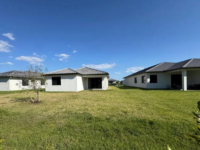 a house with yard in front of it