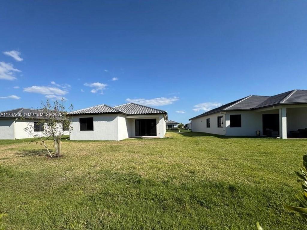 5277 Marano Drive Ave Maria, FL 34142 - Photo 16 of 23 a house with yard in front of it