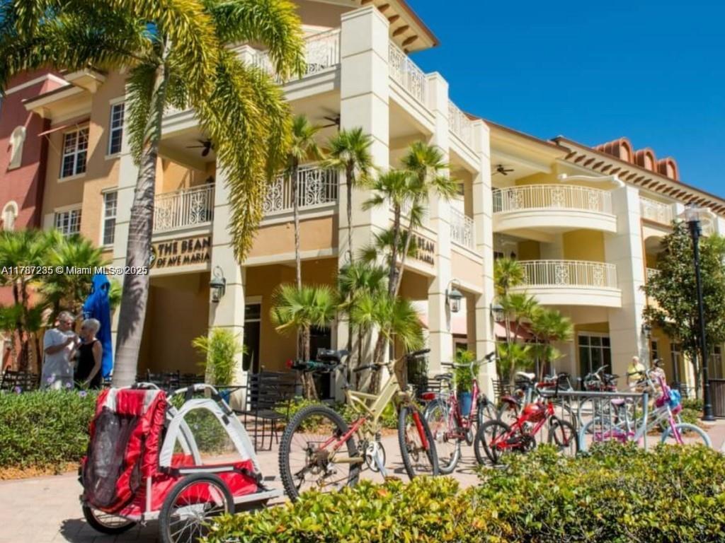 5277 Marano Drive Ave Maria, FL 34142 - Photo 22 of 23 front view of white building