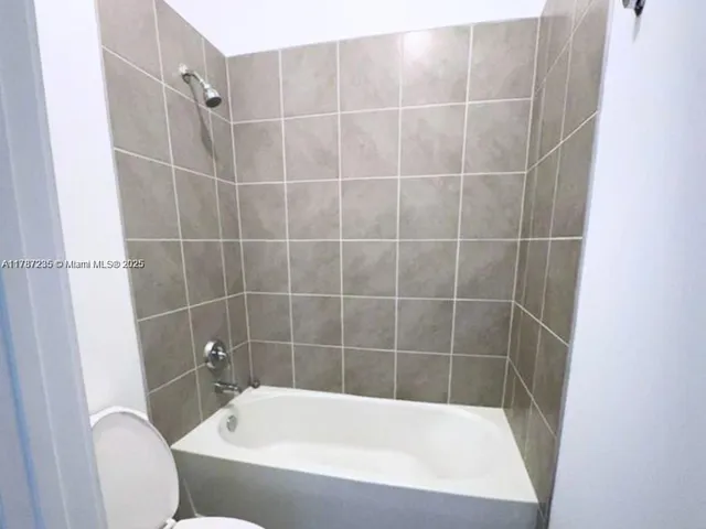 a bathroom with a bath tub