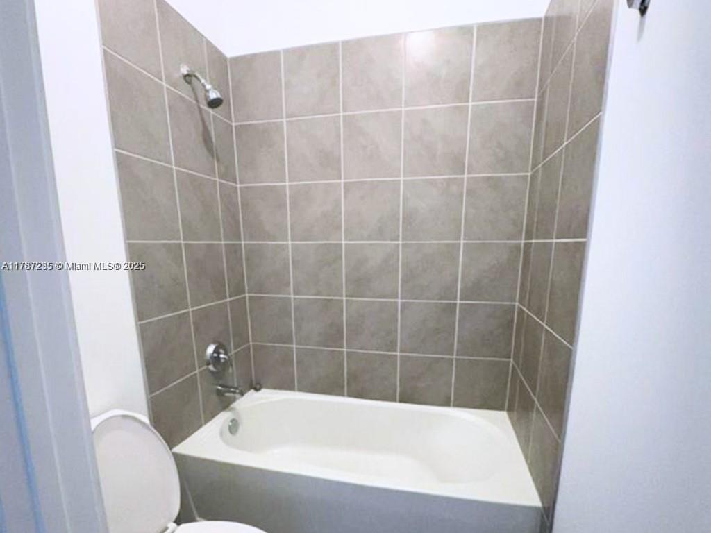 5277 Marano Drive Ave Maria, FL 34142 - Photo 10 of 23 a bathroom with a bath tub