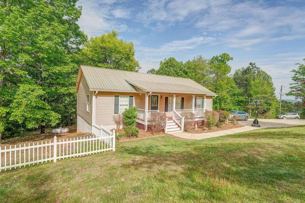 3 Wildlife Trail Rome, GA 30165 - Photo 1 of 1 a front view of a house with patio outdoor seating and yard
