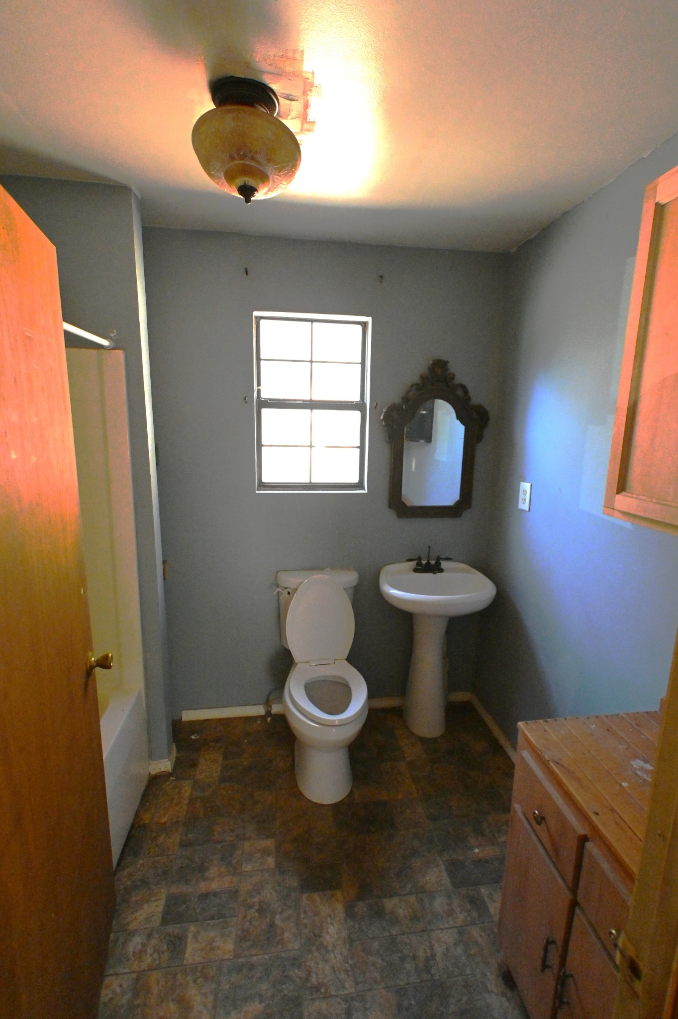 3385 Rockhouse Road Linden, TN 37096 - Photo 8 of 46 a bathroom with a toilet sink and mirror