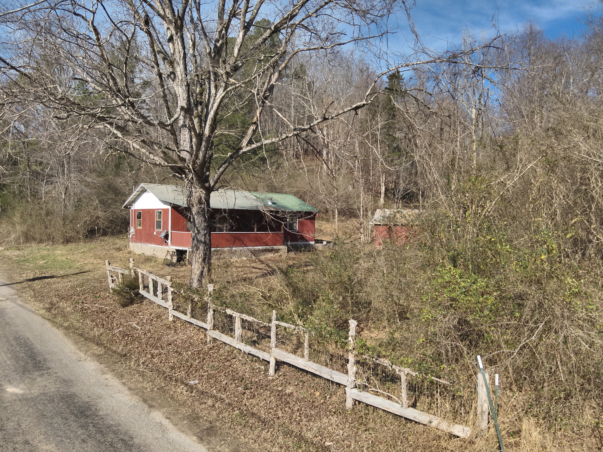 3385 Rockhouse Road Linden, TN 37096 - Photo 10 of 46 a backyard of a house with table and chairs