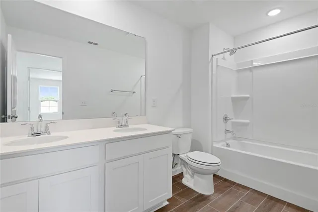 a bathroom with a toilet sink and a bathtub