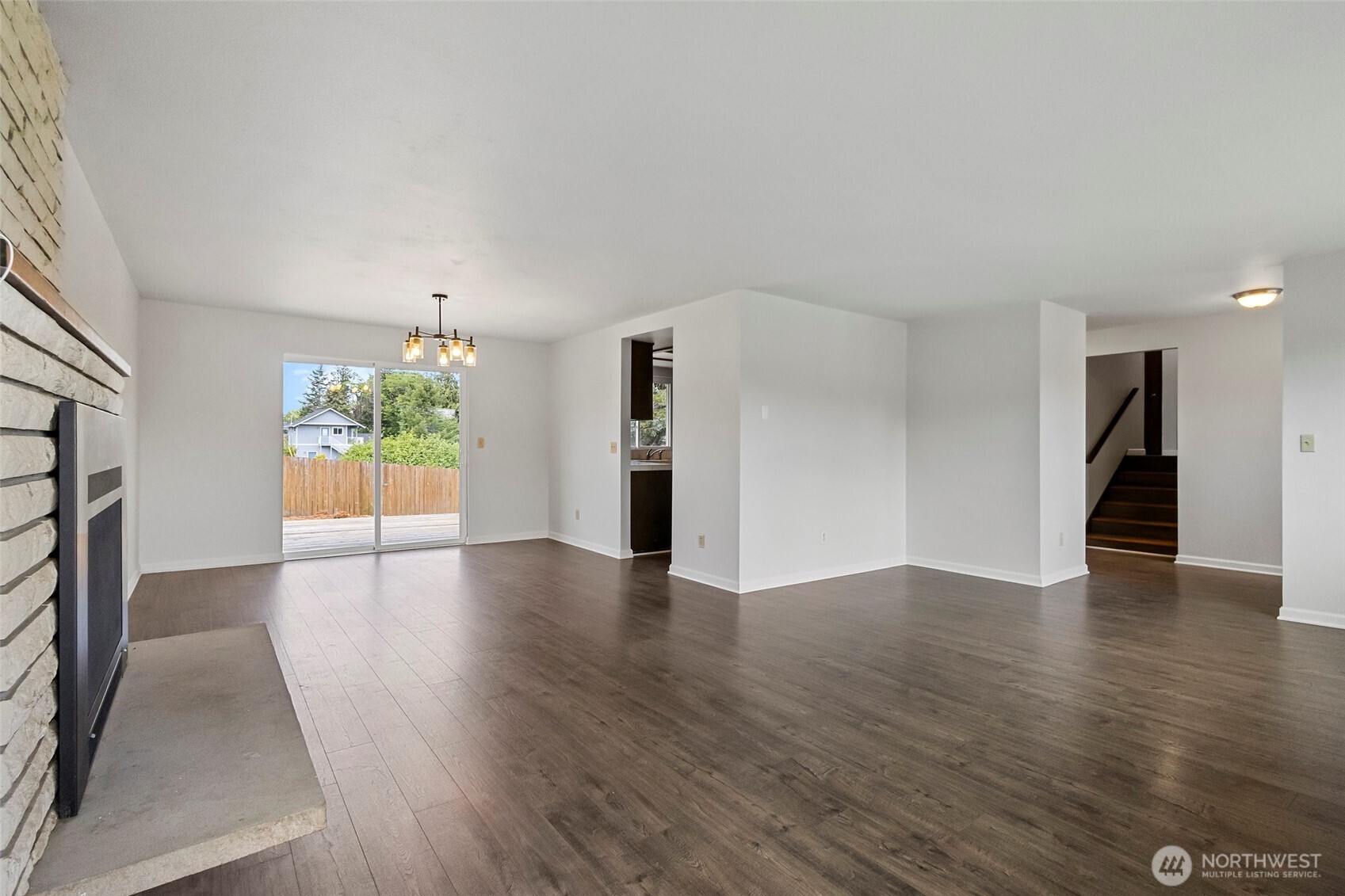 3812 R Avenue Anacortes, WA 98221 - Photo 12 of 36 a view of an empty room with wooden floor and a window