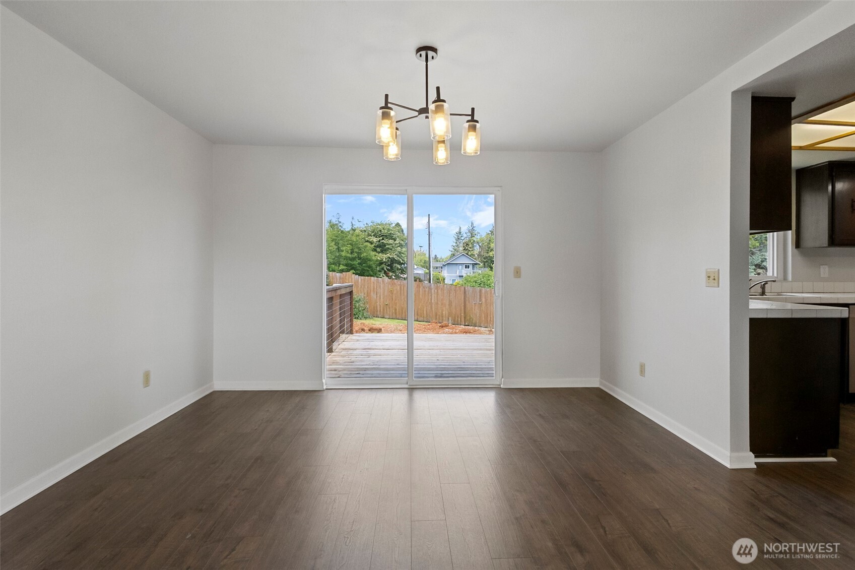 3812 R Avenue Anacortes, WA 98221 - Photo 13 of 36 a view of an empty room with wooden floor and a window