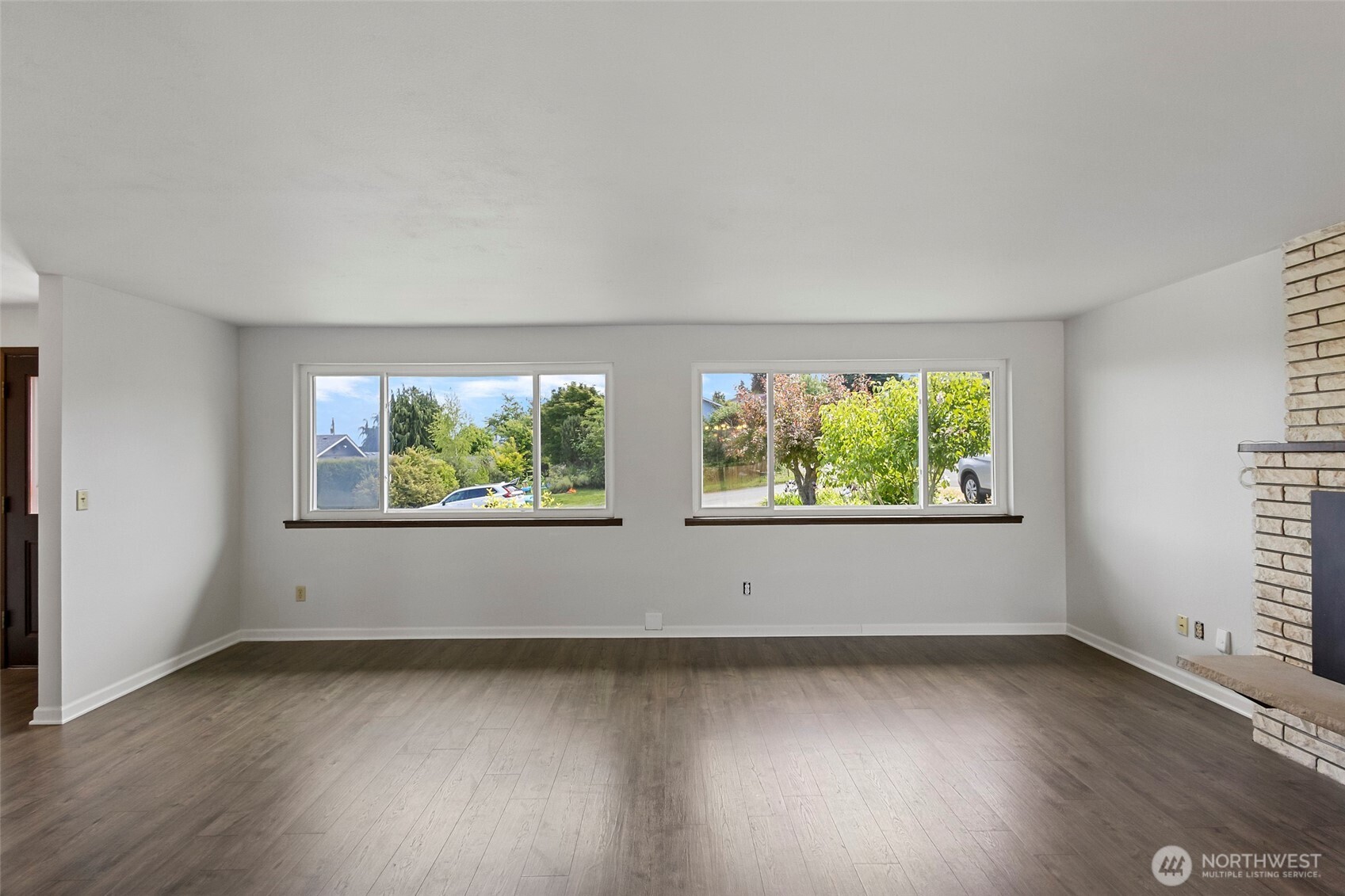 3812 R Avenue Anacortes, WA 98221 - Photo 14 of 36 an empty room with wooden floor and windows