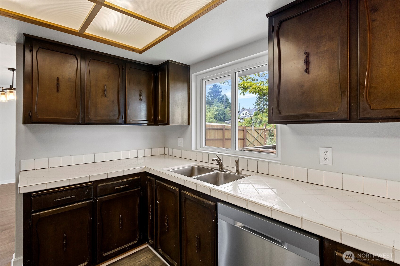 3812 R Avenue Anacortes, WA 98221 - Photo 15 of 36 a kitchen with a sink cabinets and window