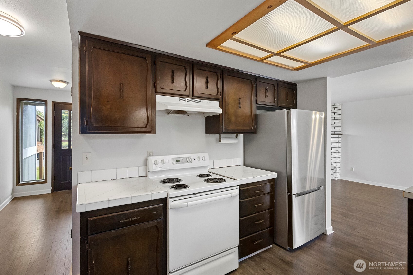 3812 R Avenue Anacortes, WA 98221 - Photo 16 of 36 a kitchen with stainless steel appliances a refrigerator stove and microwave