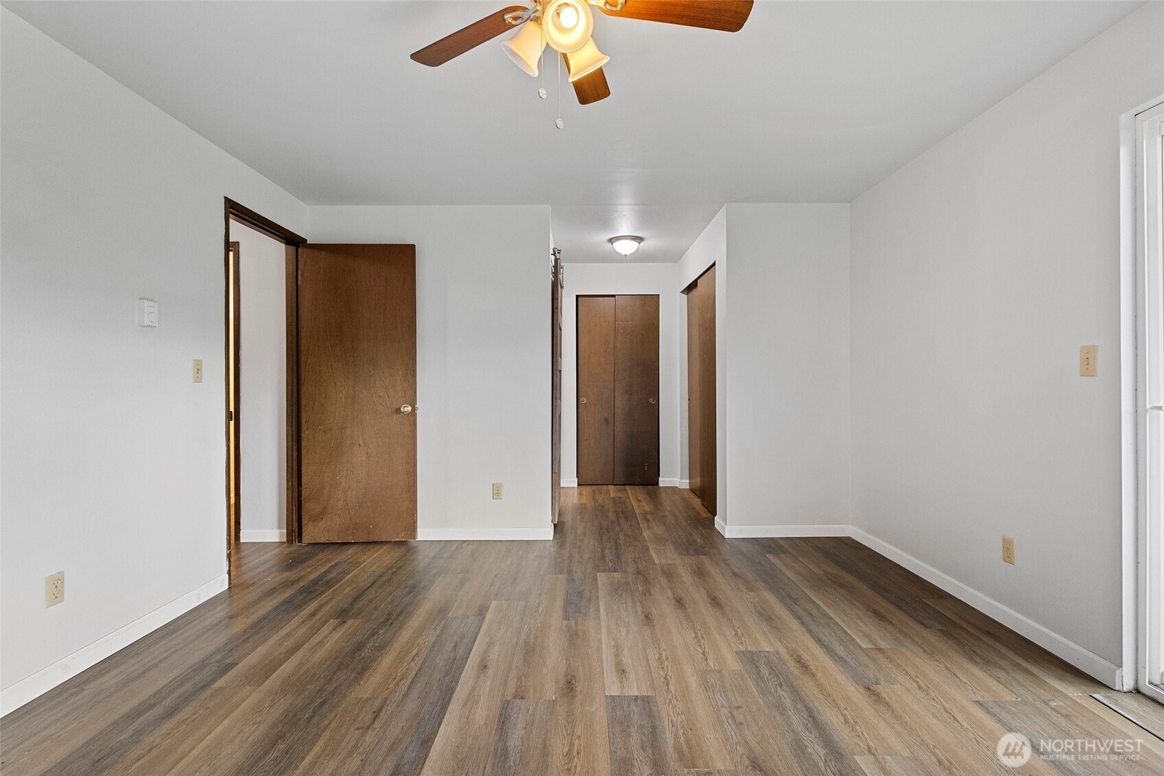 3812 R Avenue Anacortes, WA 98221 - Photo 20 of 36 wooden floor in an empty room with a window