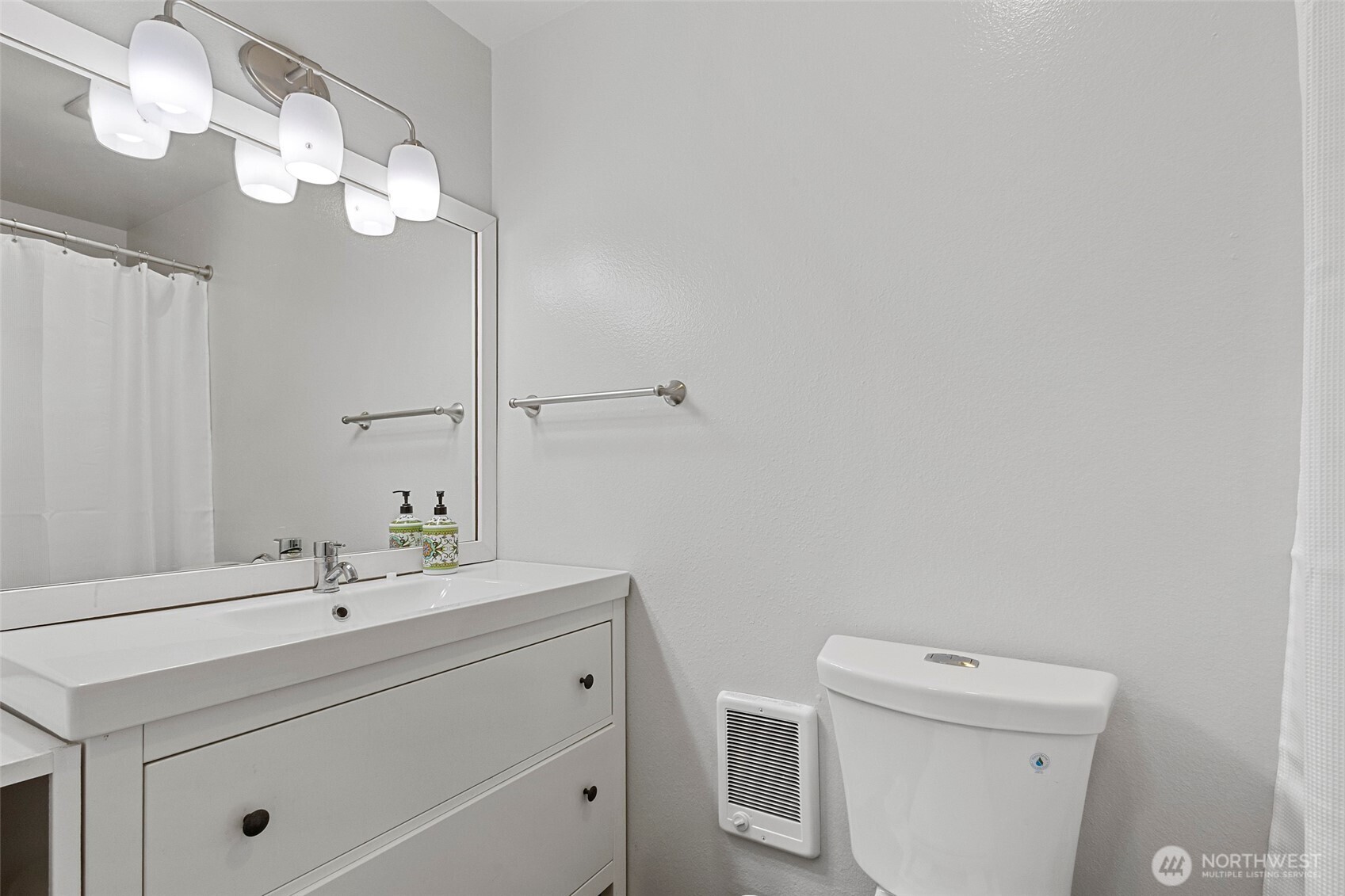 3812 R Avenue Anacortes, WA 98221 - Photo 21 of 36 a bathroom with a sink a toilet and a mirror
