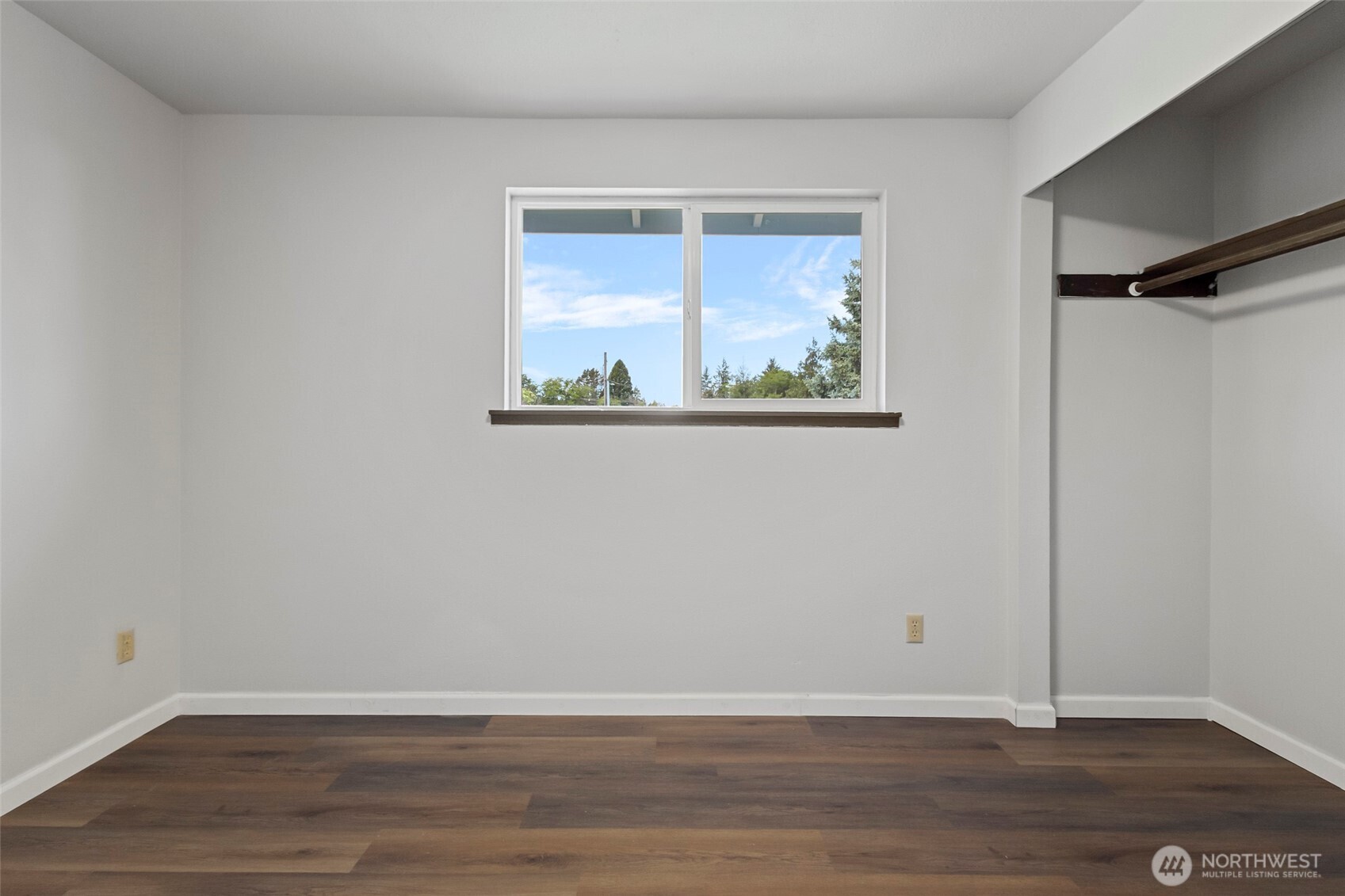 3812 R Avenue Anacortes, WA 98221 - Photo 24 of 36 a view of an empty room with wooden floor and a window