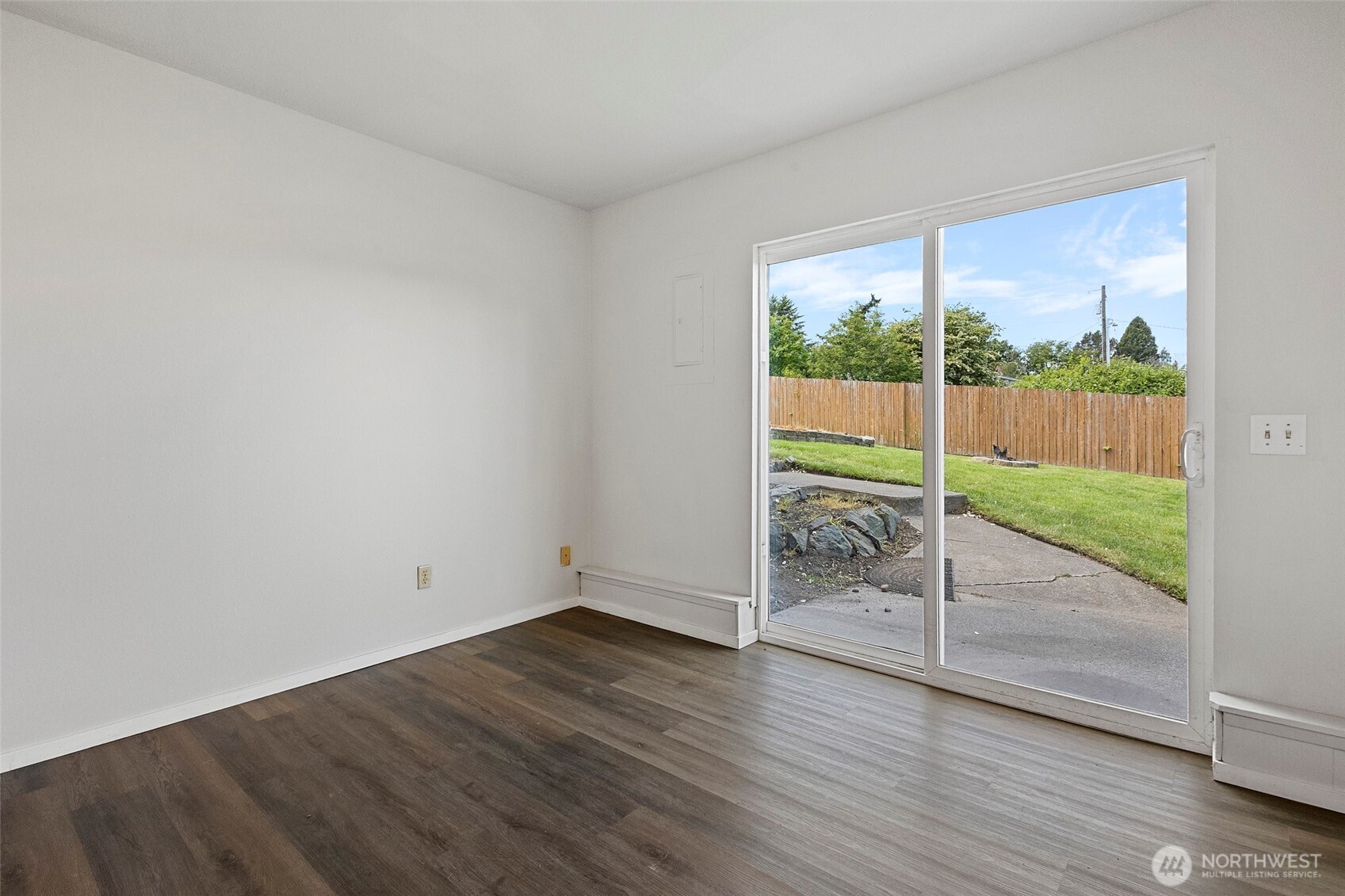 3812 R Avenue Anacortes, WA 98221 - Photo 26 of 36 an empty room with wooden floor and windows