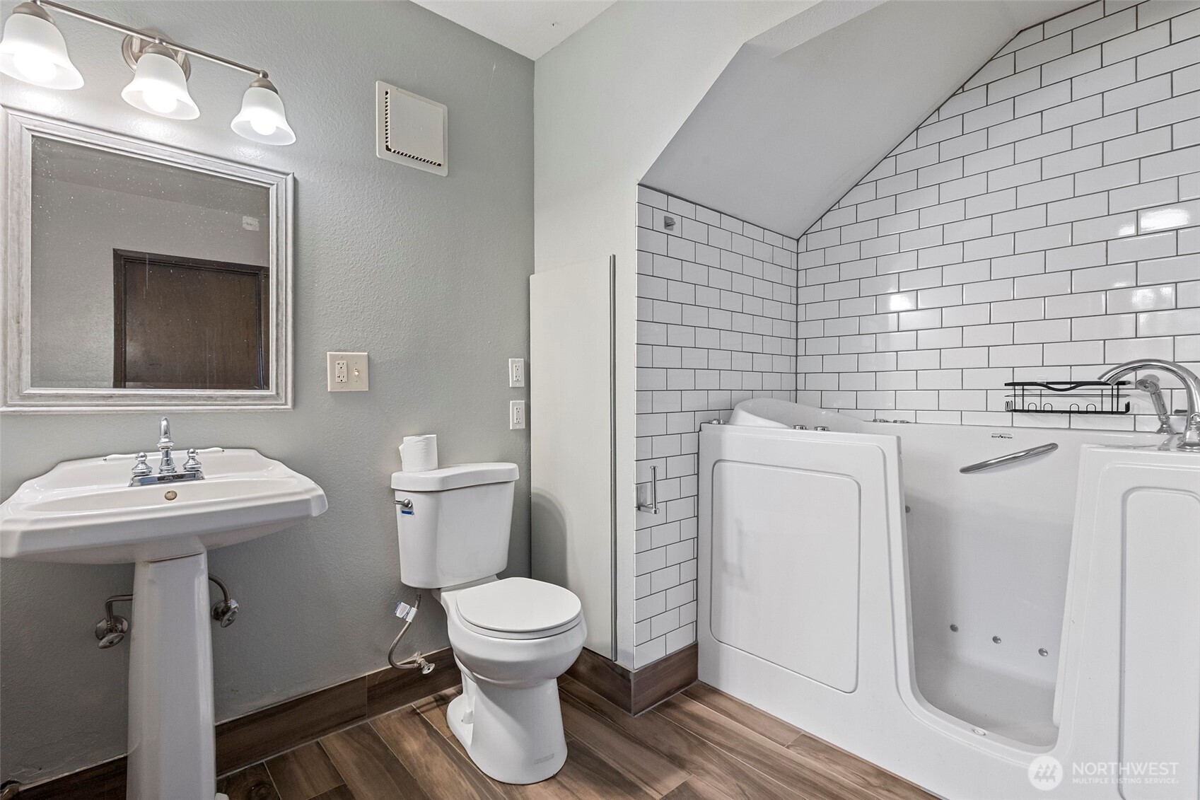3812 R Avenue Anacortes, WA 98221 - Photo 28 of 36 a bathroom with a sink toilet and mirror