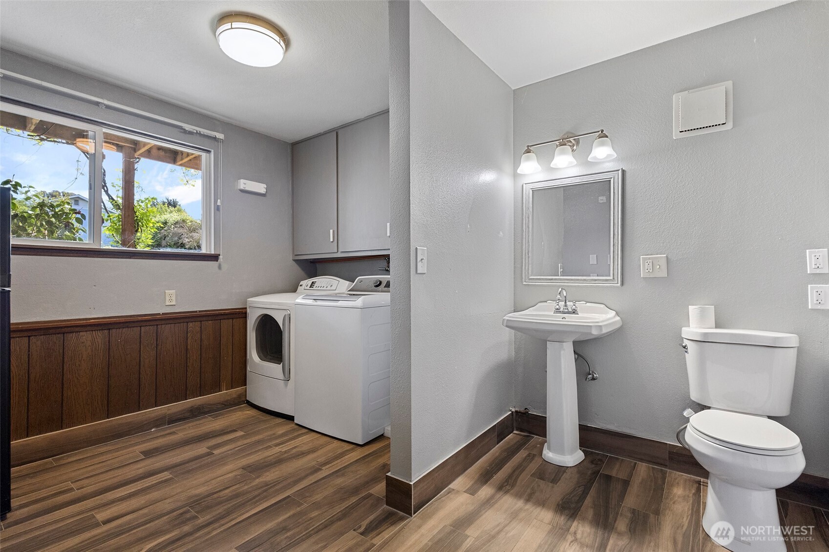 3812 R Avenue Anacortes, WA 98221 - Photo 29 of 36 a bathroom with a sink toilet and window
