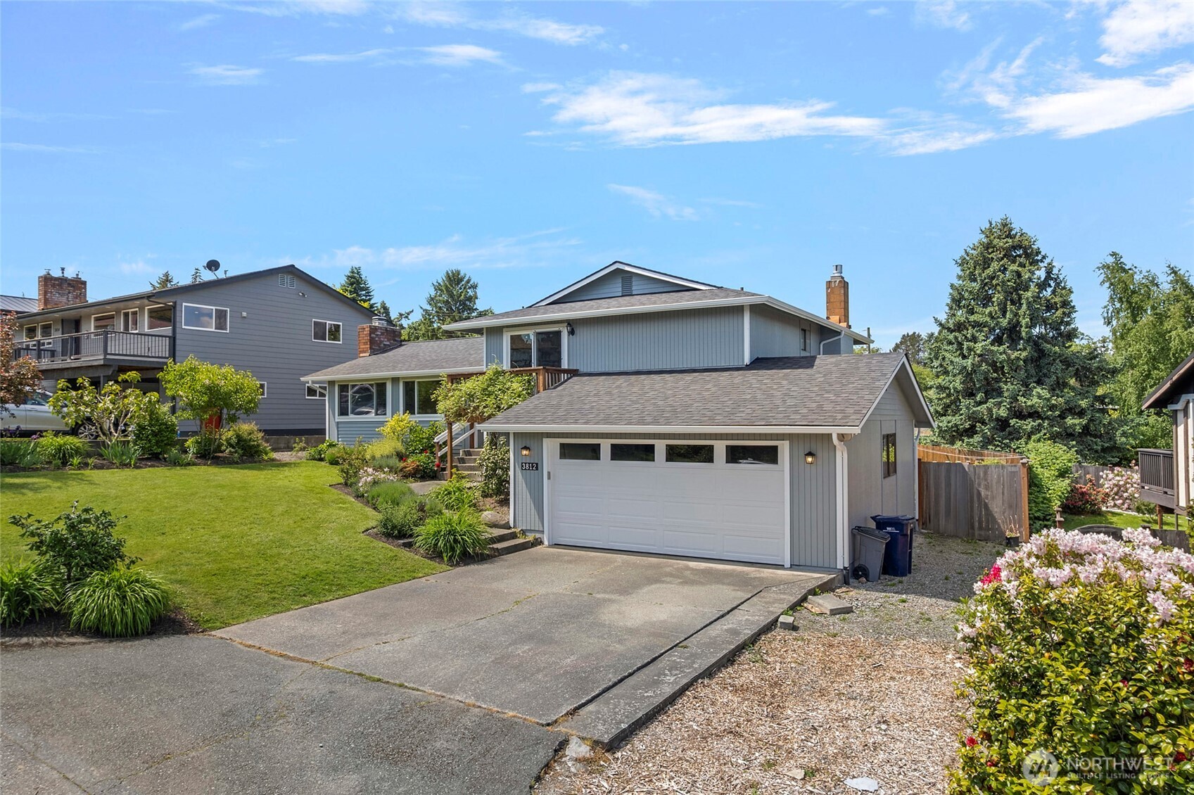 3812 R Avenue Anacortes, WA 98221 - Photo 4 of 36 a front view of a house with a garden