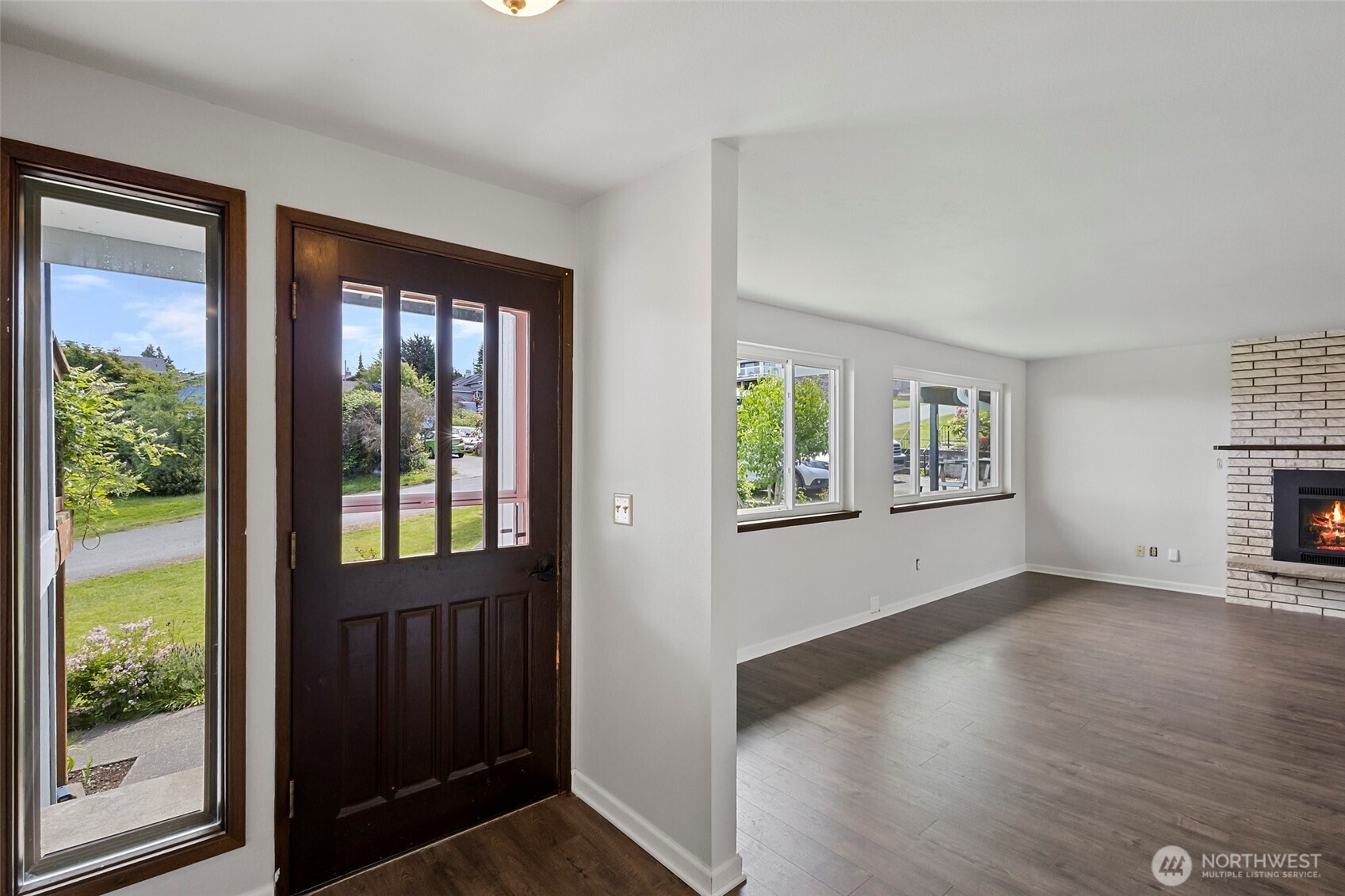 3812 R Avenue Anacortes, WA 98221 - Photo 8 of 36 an empty room with wooden floor and windows