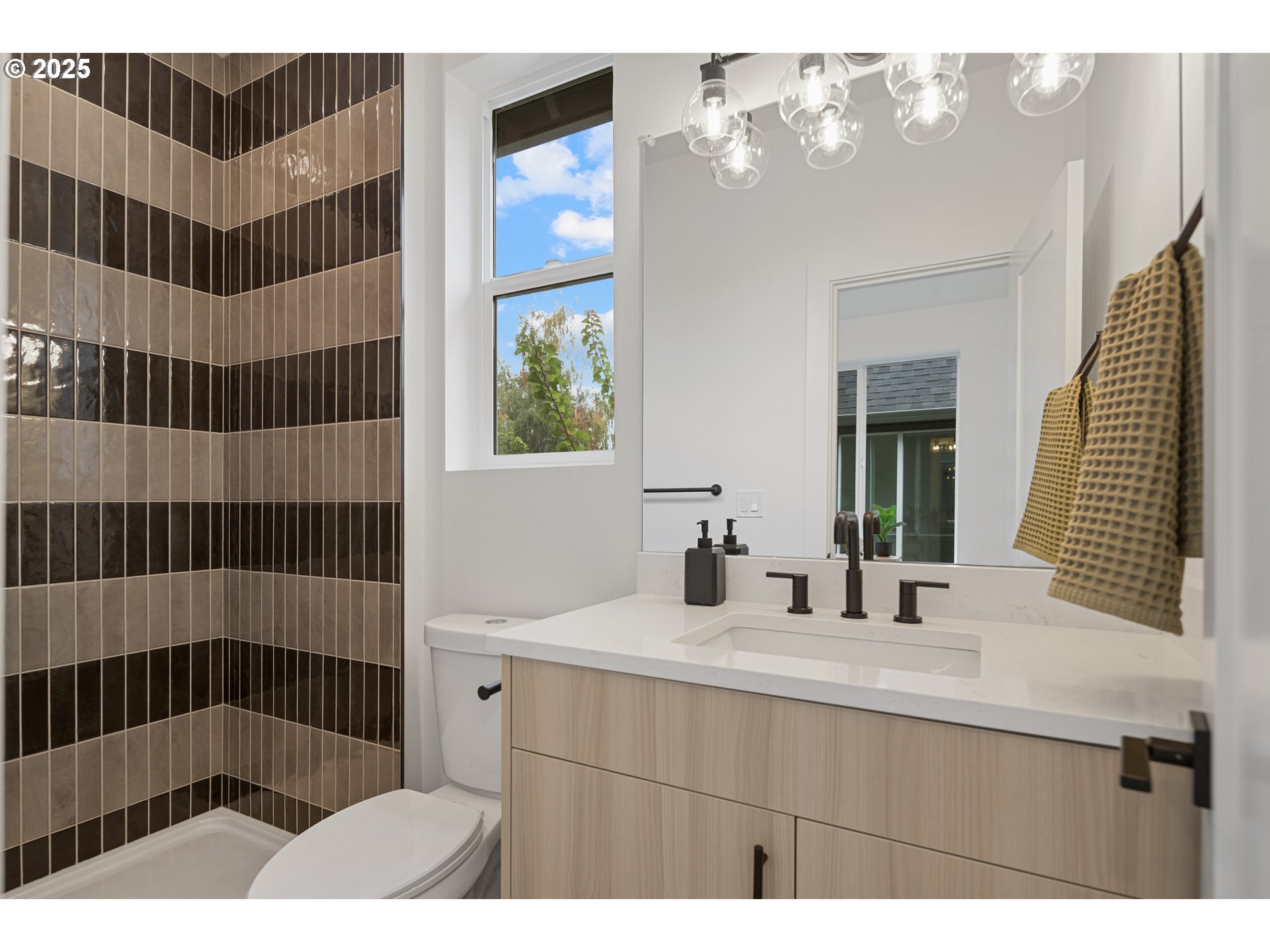 4031 Southeast Tibbetts Street Portland, OR 97202 - Photo 15 of 21 a bathroom with a sink a mirror and shower