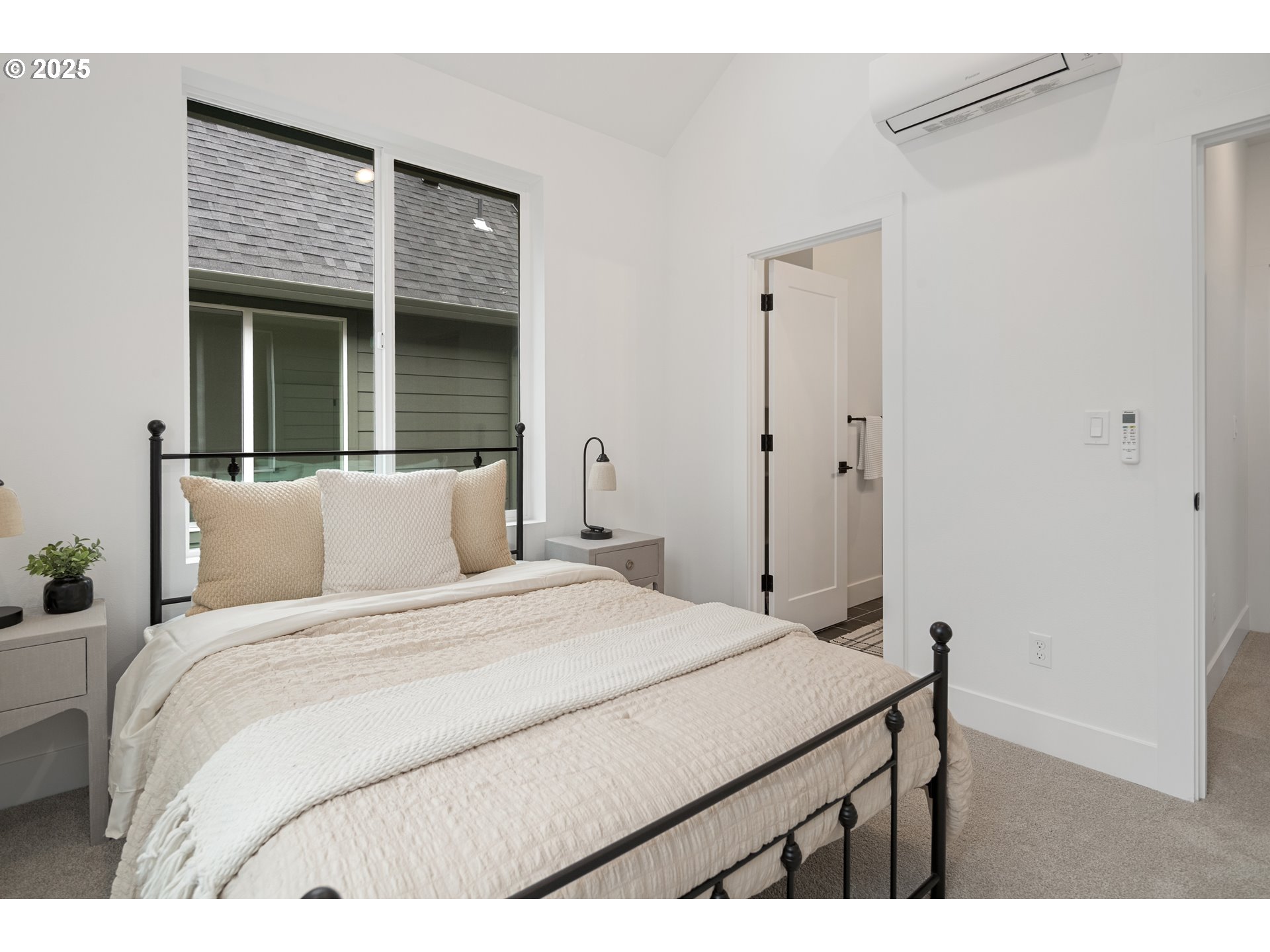 4031 Southeast Tibbetts Street Portland, OR 97202 - Photo 17 of 21 a bedroom with a bed and a window